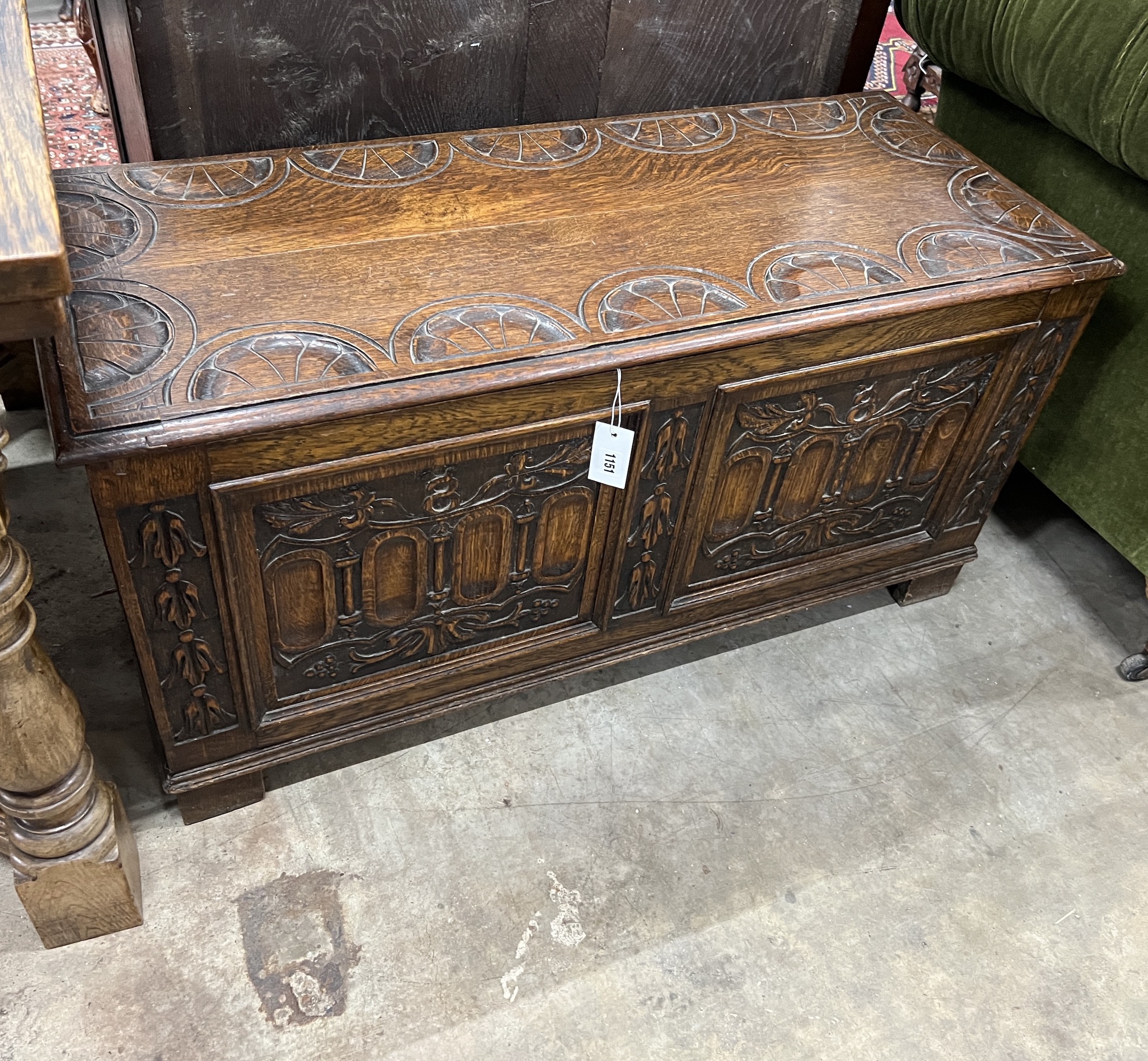 A 17th century style carved oak coffer, width 101cm, depth 42cm, height 51cm